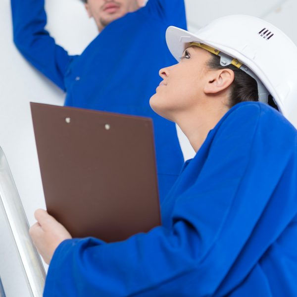 electricians working in buildings ceiling