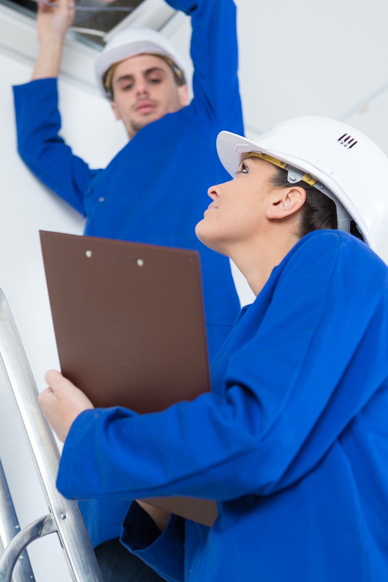 electricians working in buildings ceiling