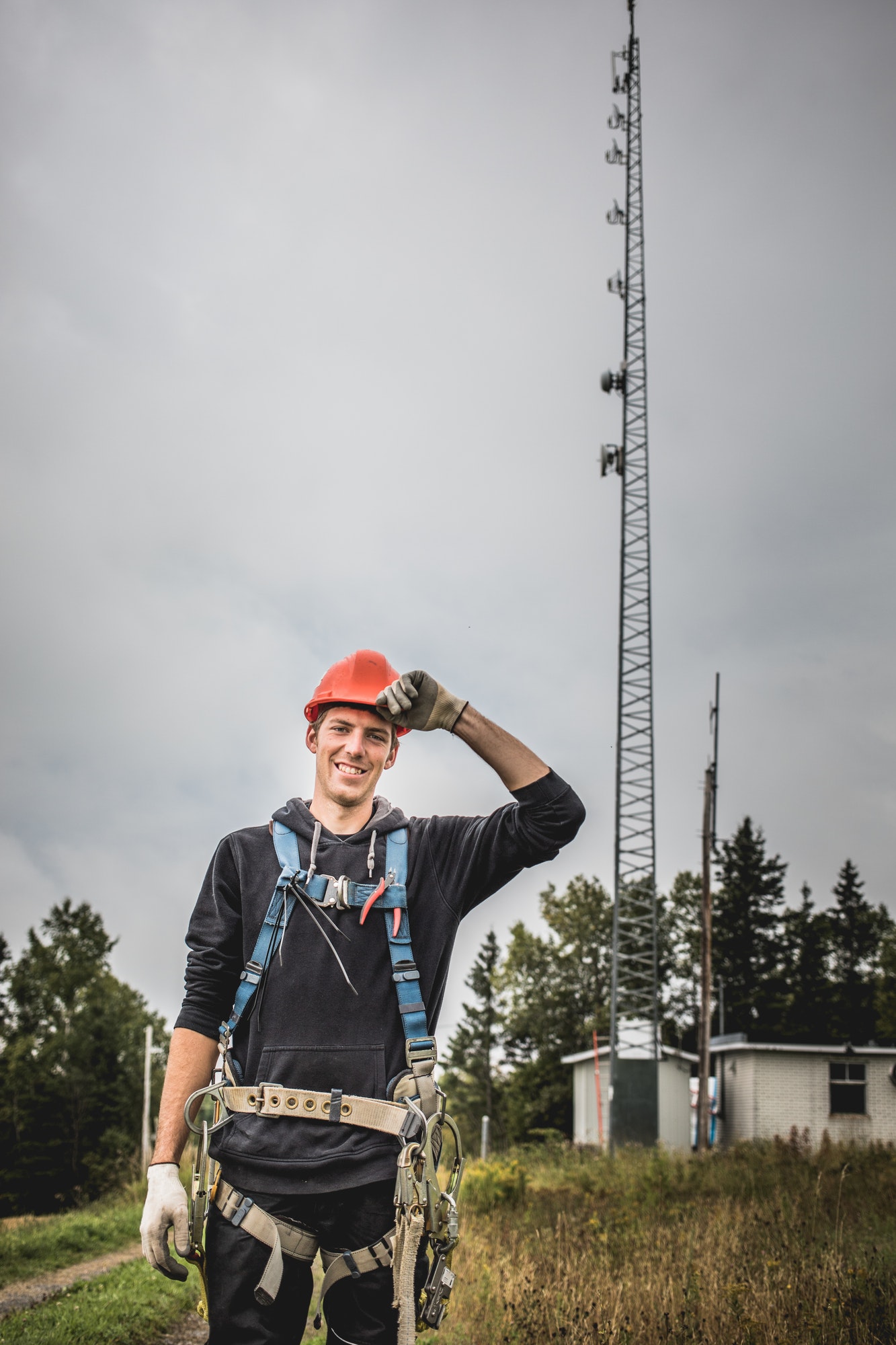 Telecom Technician man in uniform with harness